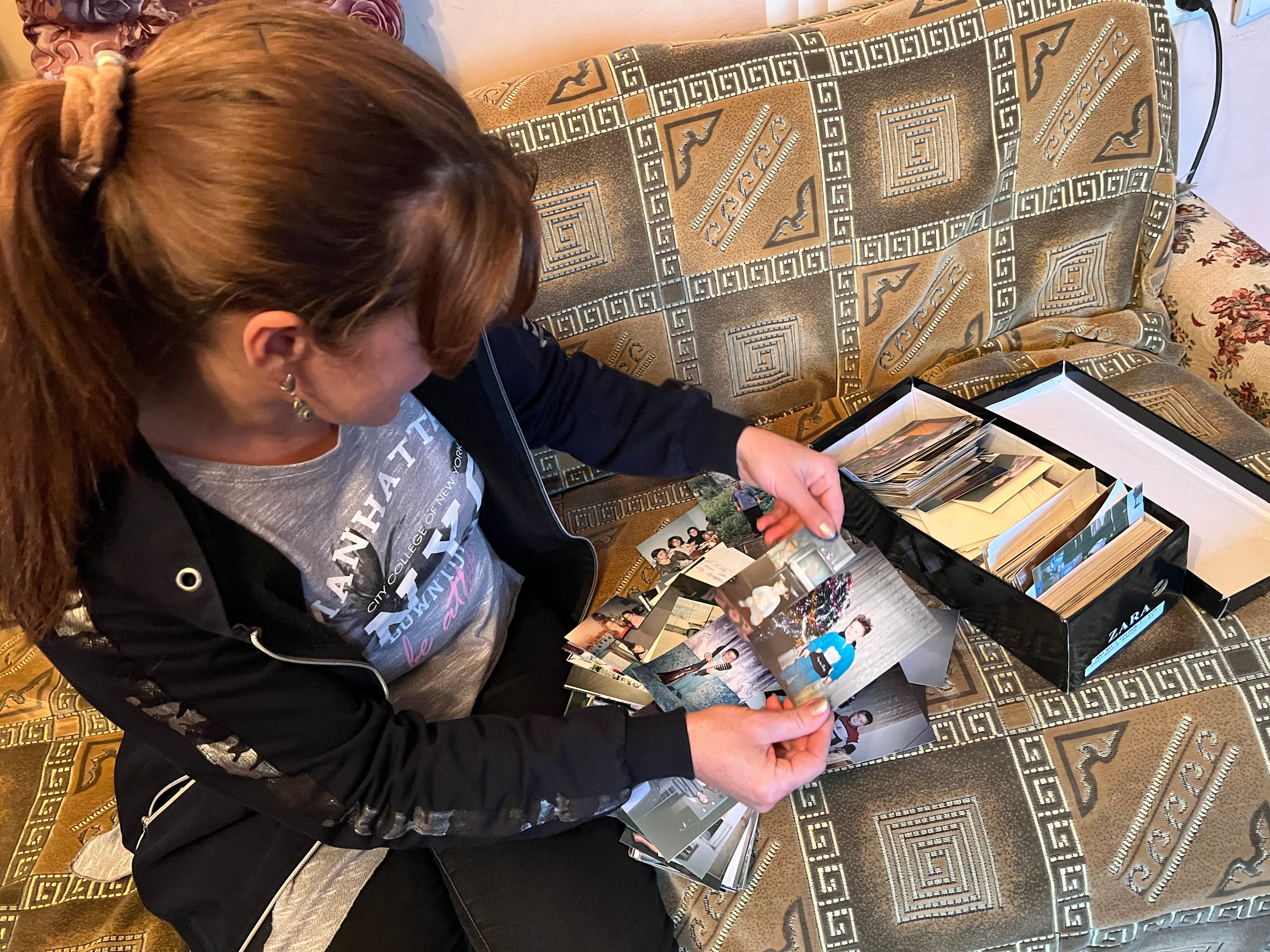 Mileta looks through the photos 