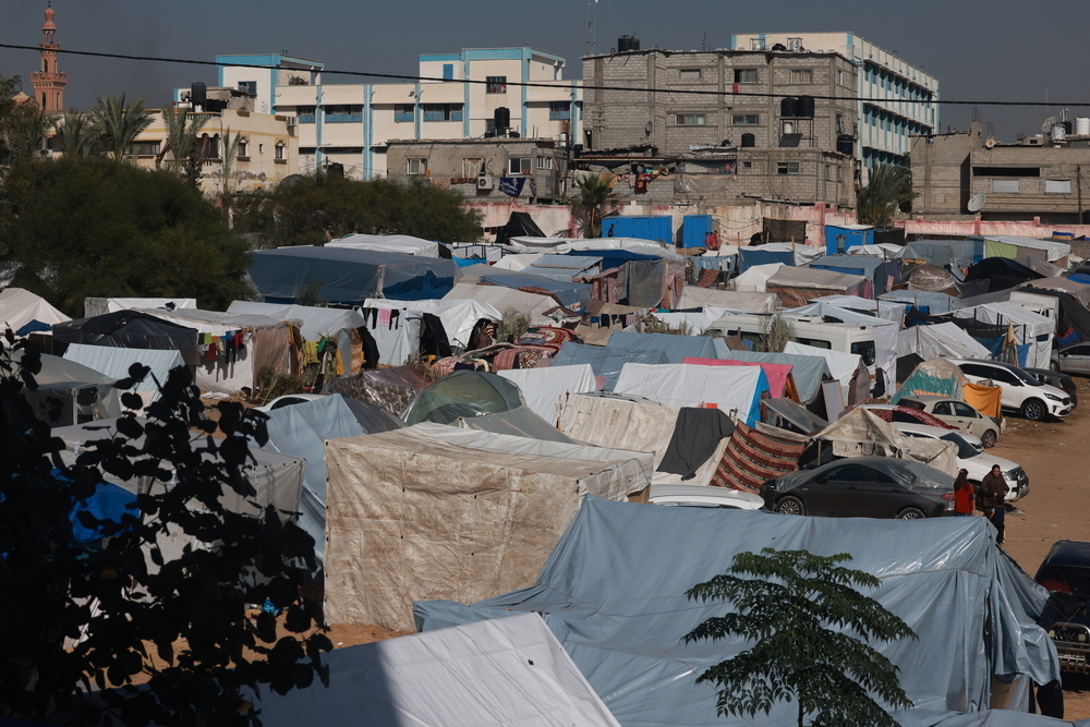 Hundreds of people camp in temporary shelters in the south of Gaza. The general conditions for most of these people are appalling: they live in temporary structures made of a few pieces of wood banged together and covered in plastic sheeting. Gaza, 24 November 2023.