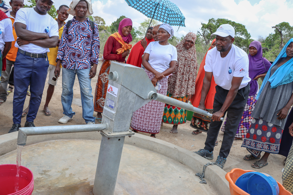President of the water committee explains to communities how the water pump works.