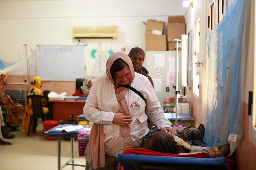 MSF medical staff checking on a patient in the paediatric emergency department