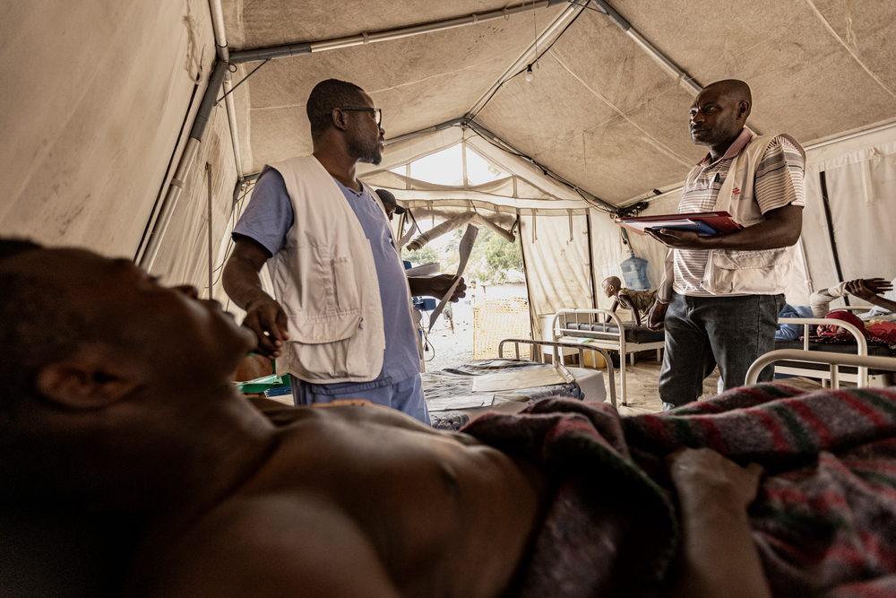 Healthcare workers with wounded patient