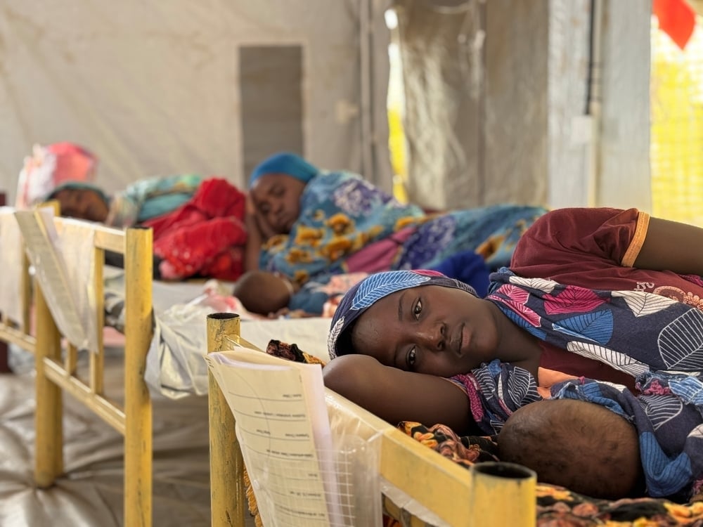Woman lying in hospital bed