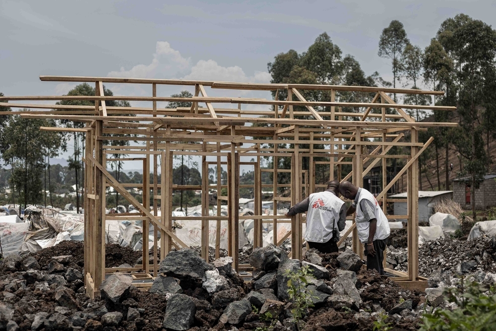 MSF staff constructing new latrines in Sam Sam camp, DRC