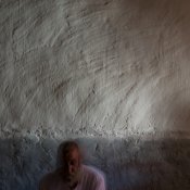 Hassan Khudeda Qasim, 51, poses in his home on Sinjar mountain. © Emilienne Malfatto / MSF